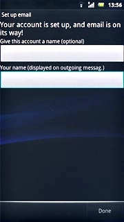 Press the field below Your name (displayed on outgoing messag.) and key in the required sender name.