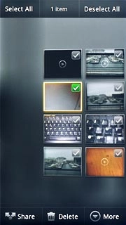 When a picture or video clip is ticked (V), it's selected.