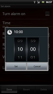 Slide hours and minutes up or down to set the time.