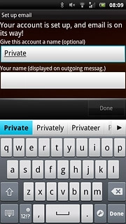 Press the field below Your name (displayed on outgoing messag.) and key in the required sender name.
