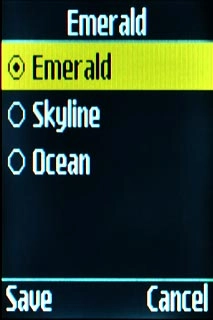 Highlight the required theme and press the Navigation key.