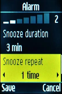 Scroll to Snooze repeat and press Navigation key right to select the required number of repetitions.