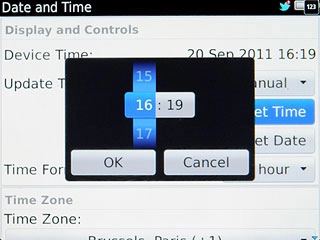 Slide hours and minutes up or down to set the time.
