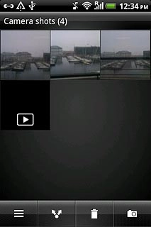 Go to the required folder.Press and hold the required picture or the required video clip until a pop-up menu is displayed.