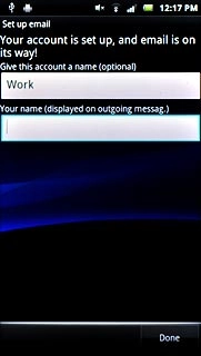 Press the field below Your name (displayed on outgoing messag.) and key in the required sender name.