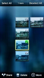 When a picture or video clip is ticked (V), it's selected.