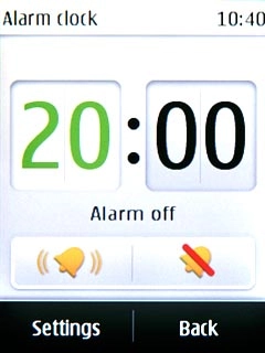 Key in the time for the alarm and press Settings.
