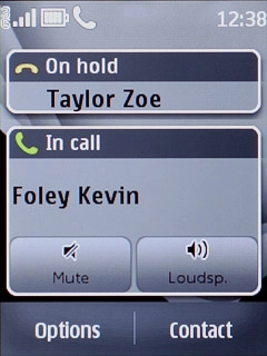 The calls are displayed on a list and the active call is displayed at the bottom.Press the required call to return to swap calls.