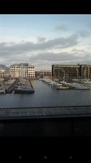 Press the first dot at the bottom of the display or the Return key to return to the list of pictures and video clips.