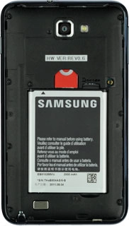 Take hold of the bottom of the battery and remove it.