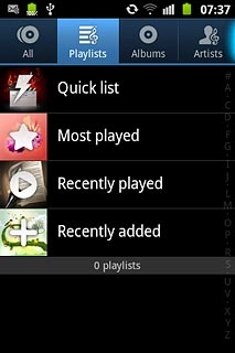 Press Playlists at the top of the display.
