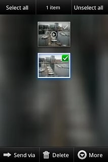 When a picture or video clip is ticked (V), it's selected.