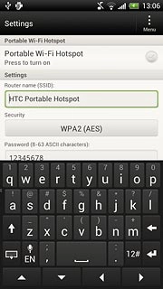 Press the field below Router name (SSID) and key in the required name for the Wi-Fi hotspot.
