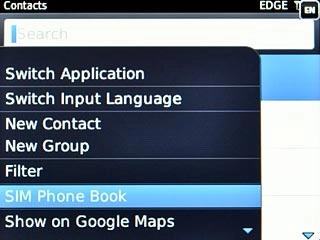 Scroll to SIM Phone Book and press the Navigation key.