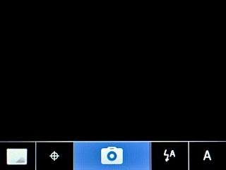 Scroll to the camera icon and press the Navigation key to take the picture.