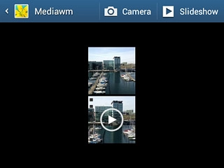 Go to the required folder.Press the required picture or the required video clip.