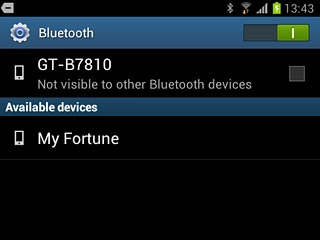 Press your phone at the top of the display to turn Bluetooth visibility on or off.