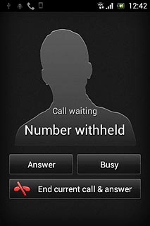 When you have an ongoing call, the new call is signalled by a sound.Press Answer.