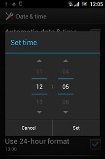 Slide hours and minutes up or down to set the time.