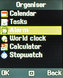Scroll to Alarm and press the Navigation key.