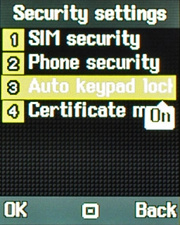 Scroll to Auto keypad lock and press the Navigation key.