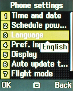 Scroll to Language and press the Navigation key.