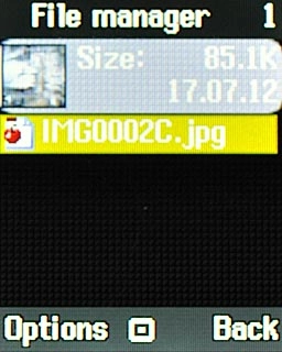 Go to the required folder.Highlight the required picture or the required video clip and press Options.