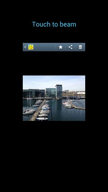 Hold your phone and the receiving phone back to back.When Touch to beam is displayed, press anywhere on the display to start the transfer.Follow the instructions on the display to finish the transfer.