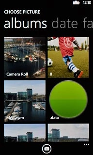To take a new picture:Press the camera icon.