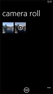 Go to the required folder.Press the required picture or the required video clip.