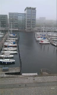 Press the dots in the bottom right corner of the display.