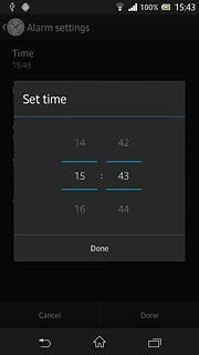 Slide hours and minutes up or down to set the time.