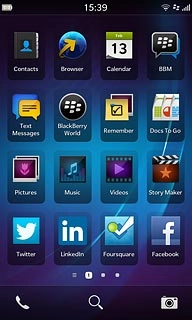 Slide your finger left across the display to open the main menu.Press BlackBerry World.