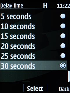 Highlight the required divert delay time and press the Navigation key.