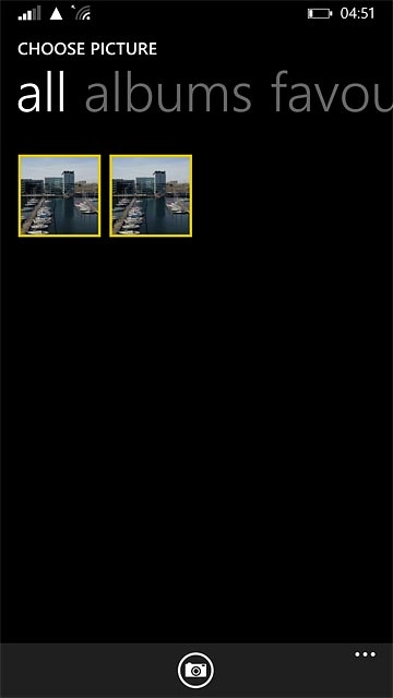 To take a new picture:Press the camera icon.