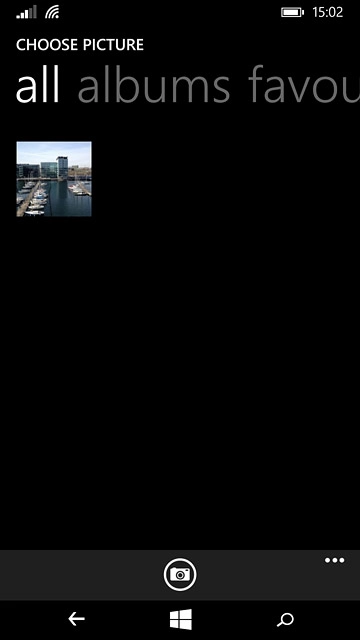 To take a new picture:Press the camera icon.