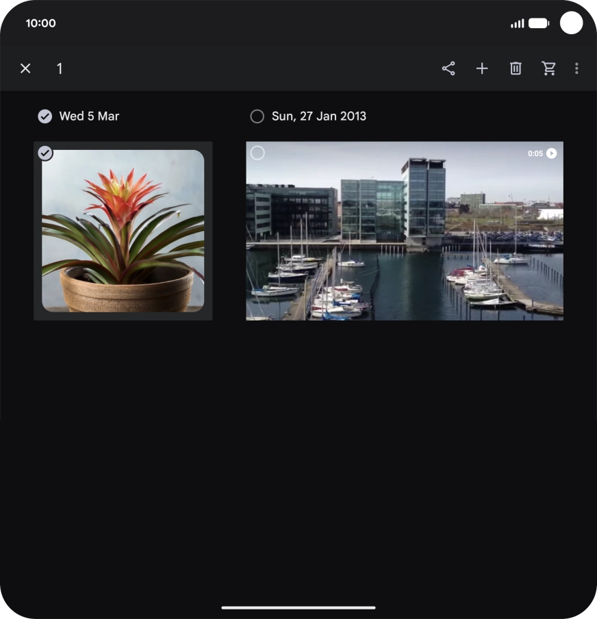 Press the required pictures or videos to select them.