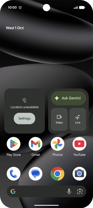 The alarm icon shows that the alarm is set.