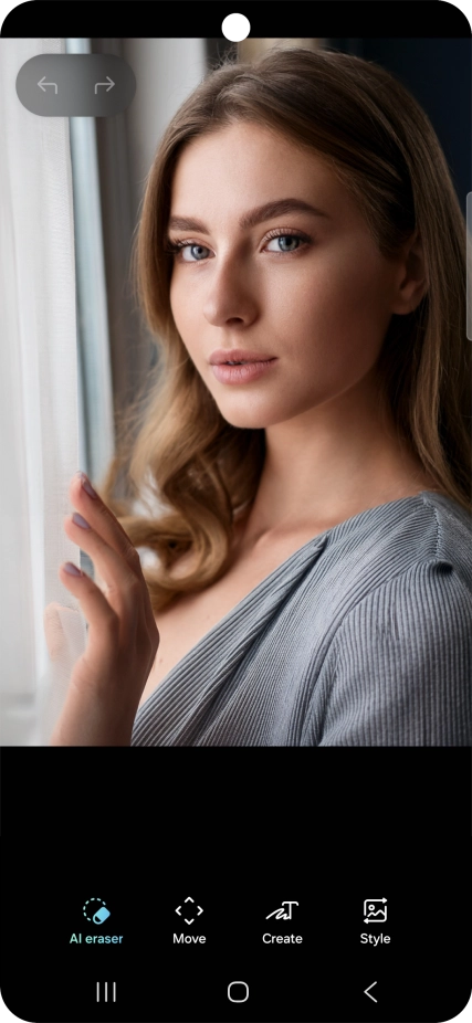 To remove objects from your picture, press AI eraser and follow the instructions on the screen to use the function.