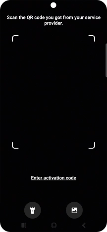 Place the QR code you've received inside the phone camera frame to scan the code. Your eSIM is transferred to your new phone over the internet.