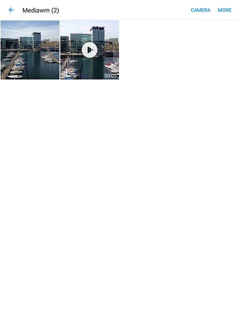 Go to the required folder.Press and hold the required picture or the required video clip.