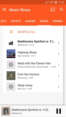 Press the song title at the bottom of the screen.