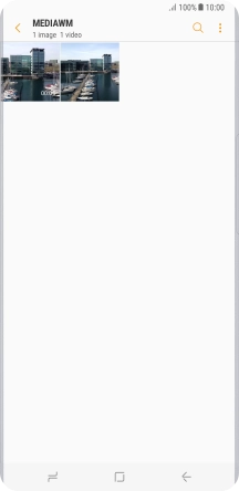 Press and hold the required picture or video clip. Press and hold the required picture or video clip.