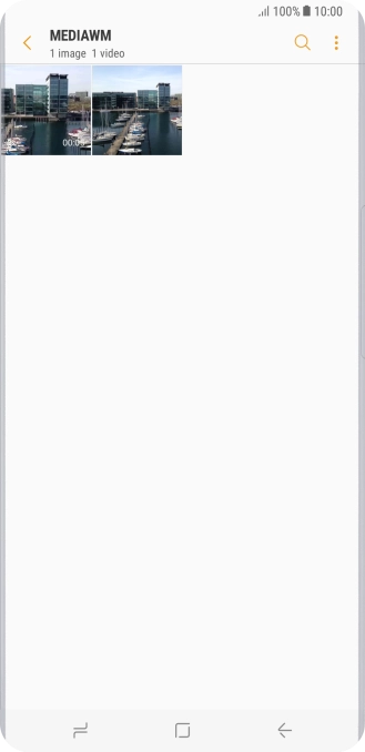 Press and hold the required picture or video clip. Press and hold the required picture or video clip.