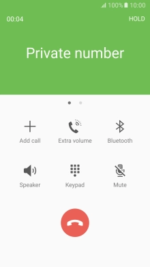 Press the end call icon.