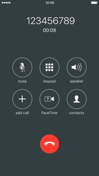 Press the end call icon.