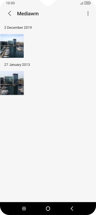 Press and hold any picture or video clip. Press and hold any picture or video clip.