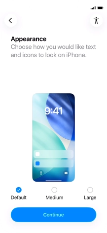 Select the required text and icon size on your phone and press Continue.