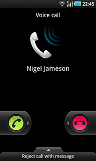 Press the reject call icon and drag the icon left.