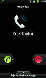 When you have an ongoing call, the new call is signalled by a sound.Press the accept call icon and drag the icon right.
